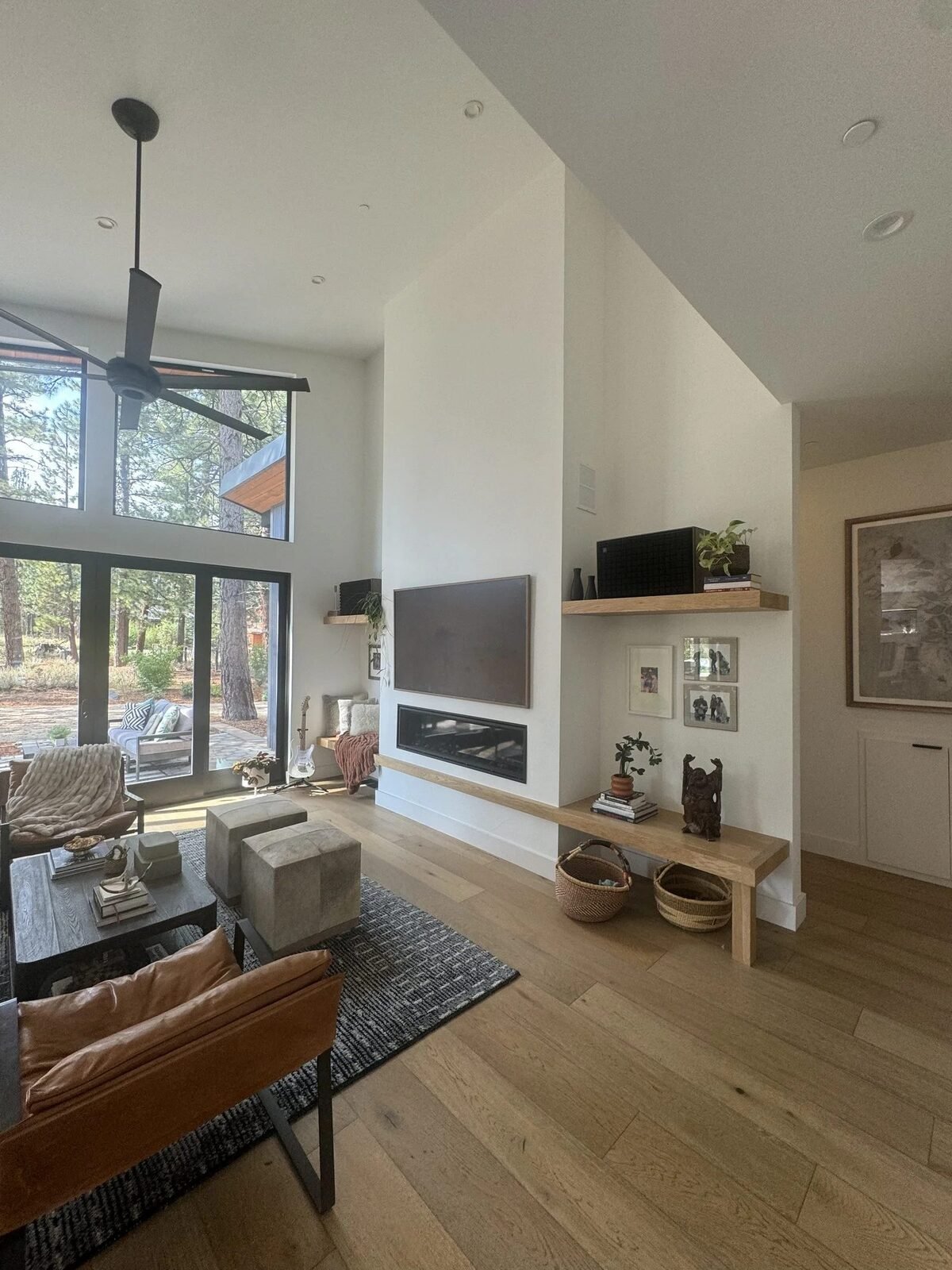 Custom home great room with floor-to-ceiling windows and linear fireplace Truckee CA