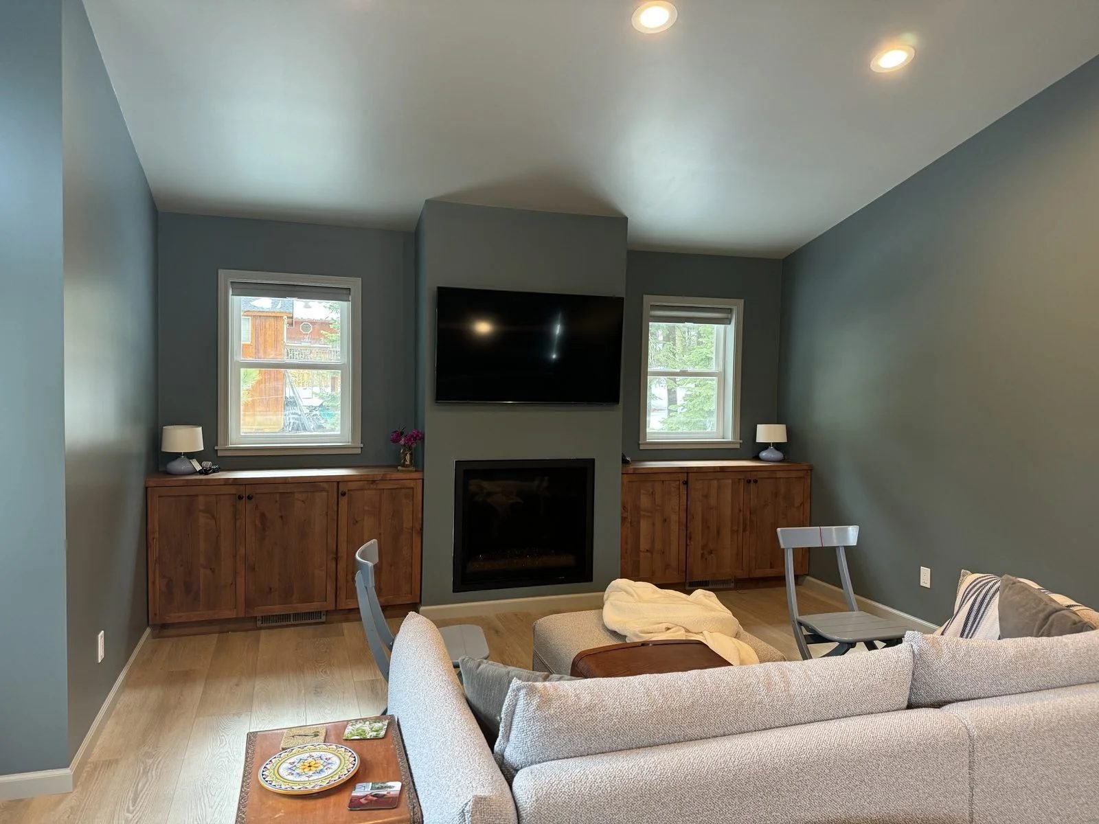 Finished living room interior renovation with custom knotty alder built-in cabinets and linear fireplace Reno NV