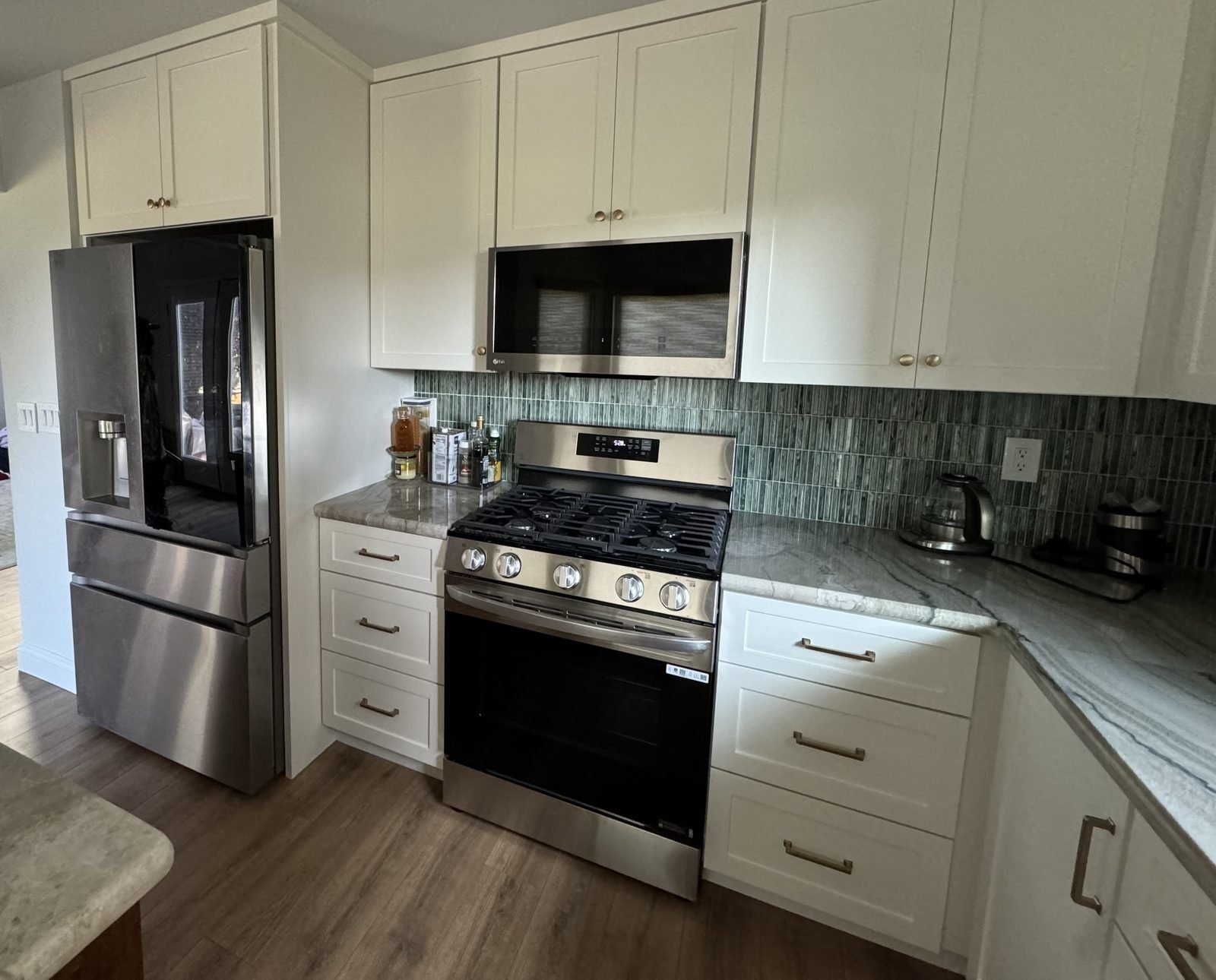 Completed kitchen renovation Reno NV — full view with island, LG appliances and custom cabinetry