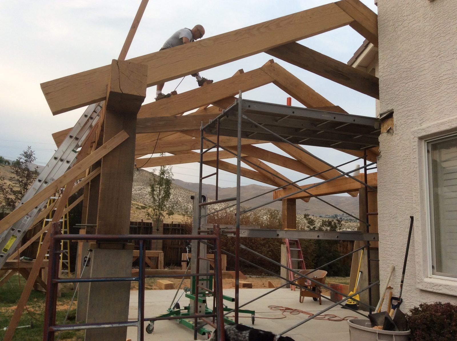 Carpenter working on timber patio cover ridge beam Reno NV